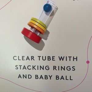 Lovevery clear tube w/stacking rings and baby ball
